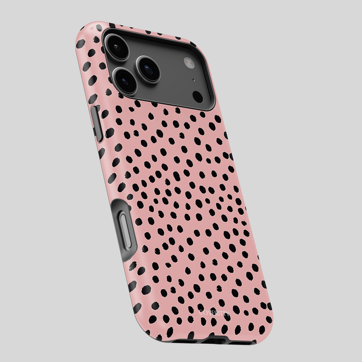 Protective slim phone case featuring abstract black polka dots on pink