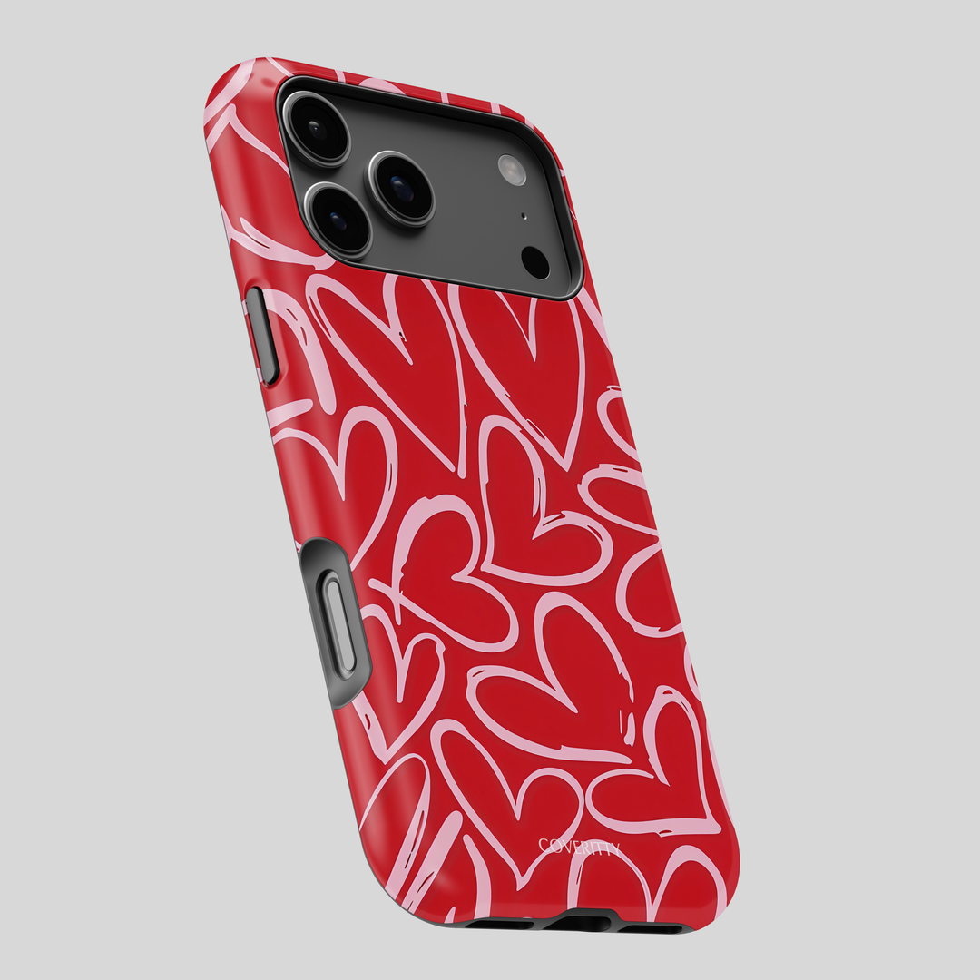 Phone case with red and white heart pattern on a gray background