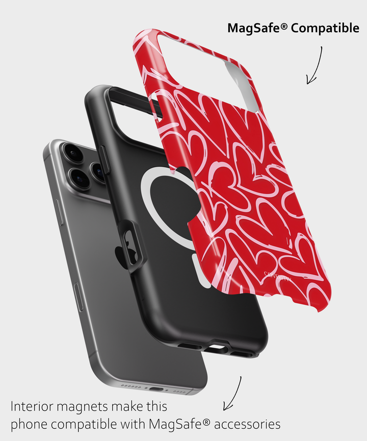 Two phone cases, one black and one red with white hearts, on a light gray background.